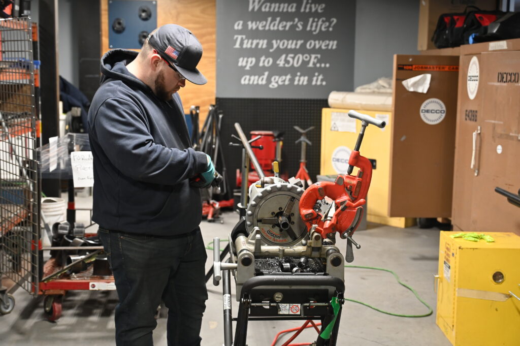 DECCo pipefitter with pipefitting machine